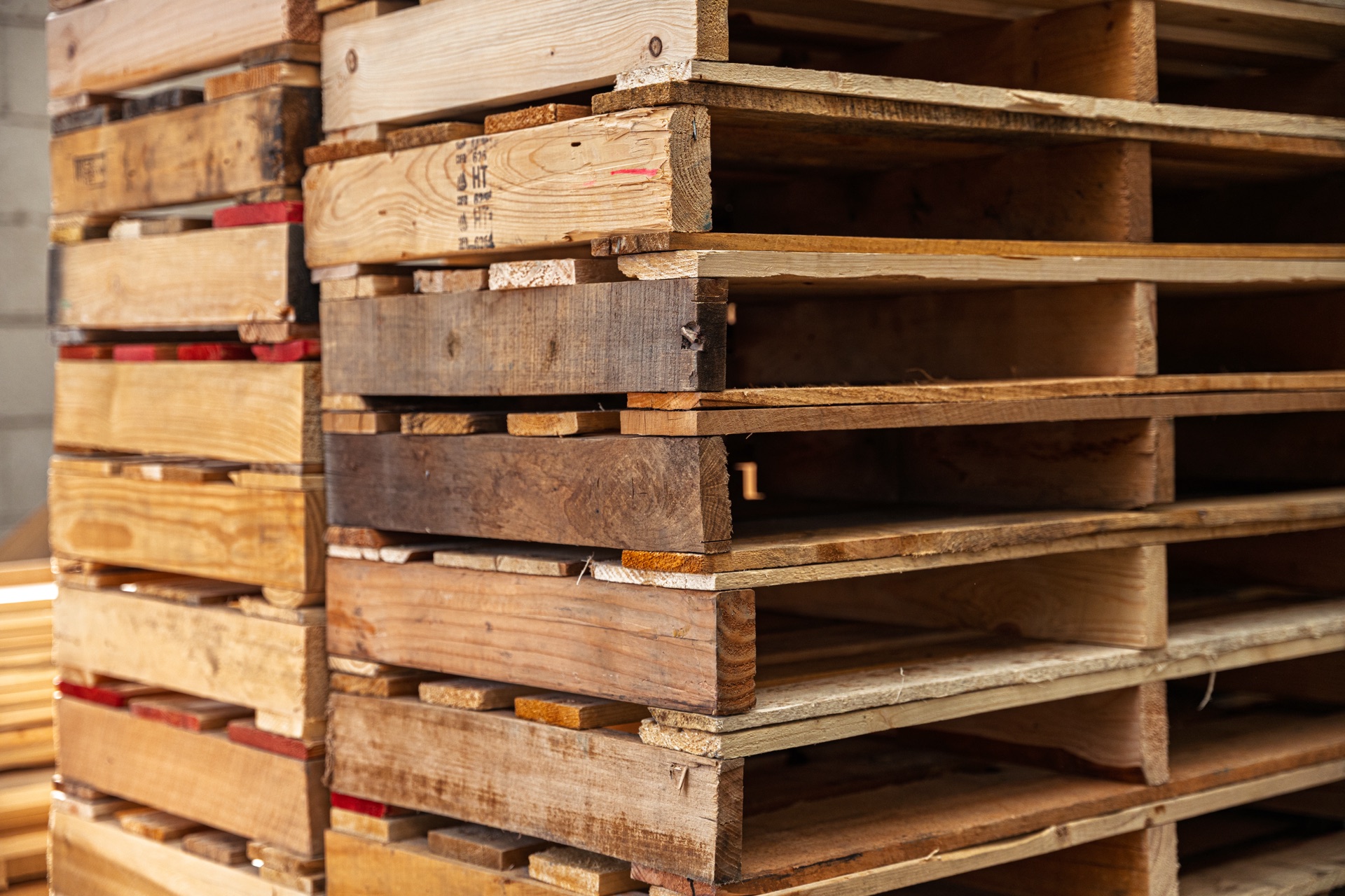 Stacked recycled pallets at CRI facility